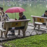 Reading by the lake in Hanoi
